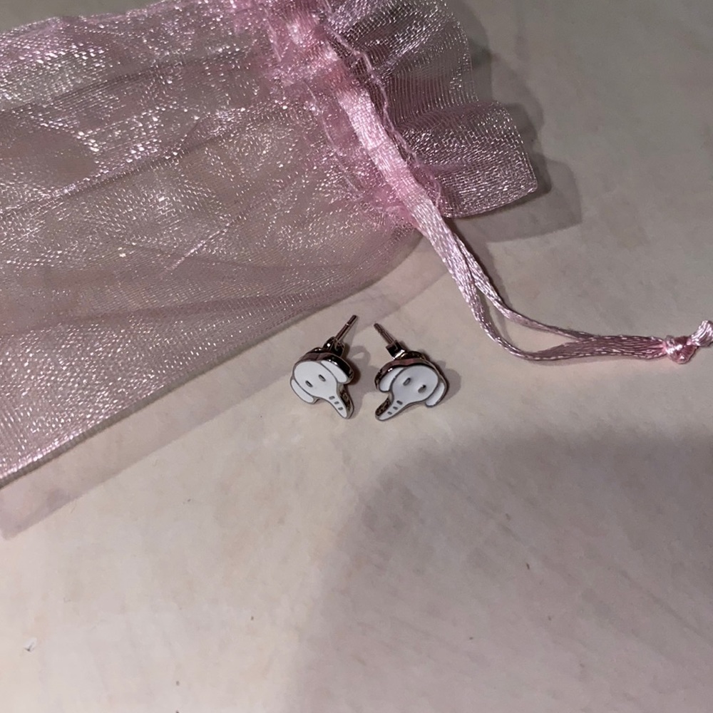 Dainty white and silver elephant head stud earrings Nickel free.